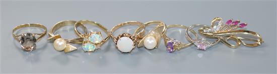 A modern 10ct gold, opal and diamond ring, six other gem set rings including five 9ct and a 9ct and gem set brooch, gross 16 grams.